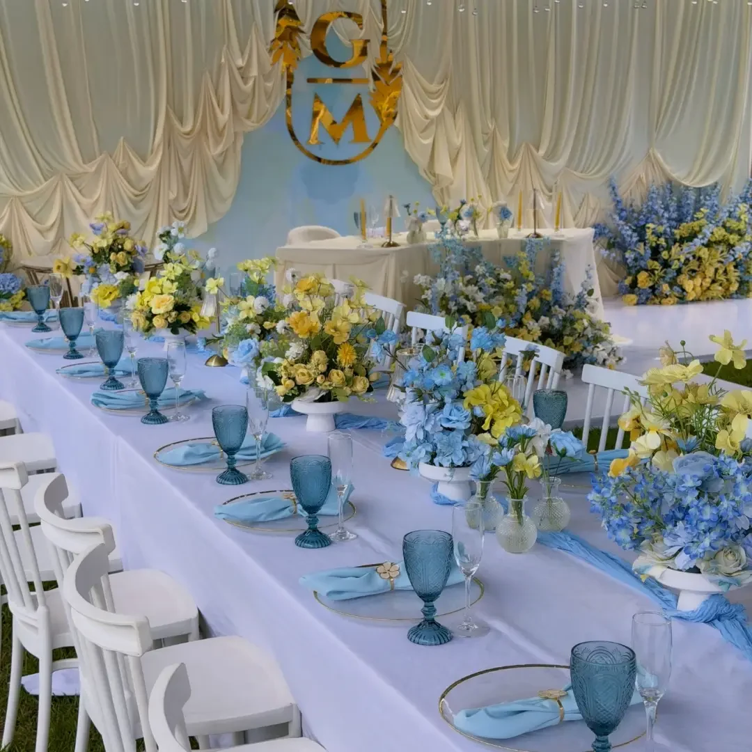 Blue and lemon banquet with monogram backdrop