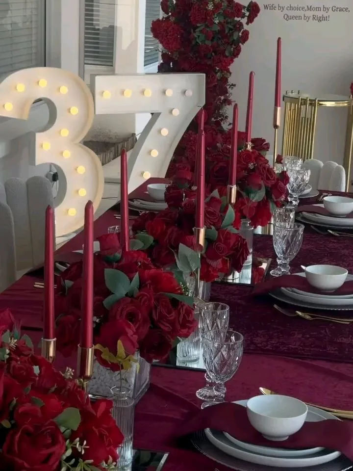 Burgundy linen place setting with gold cutlery