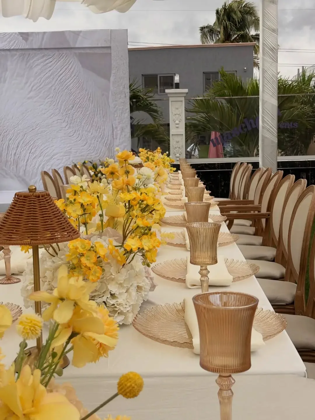 Yellow florals and gold goblets place setting