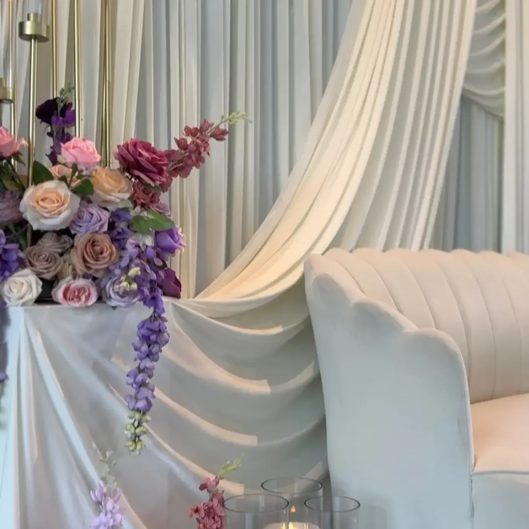 Pink and purple rose centrepiece with candles
