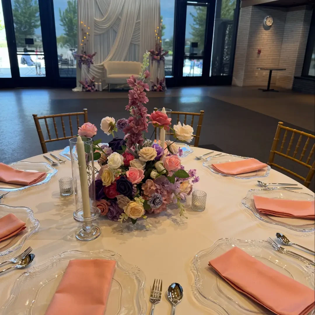 Pink and purple round table with gold chairs