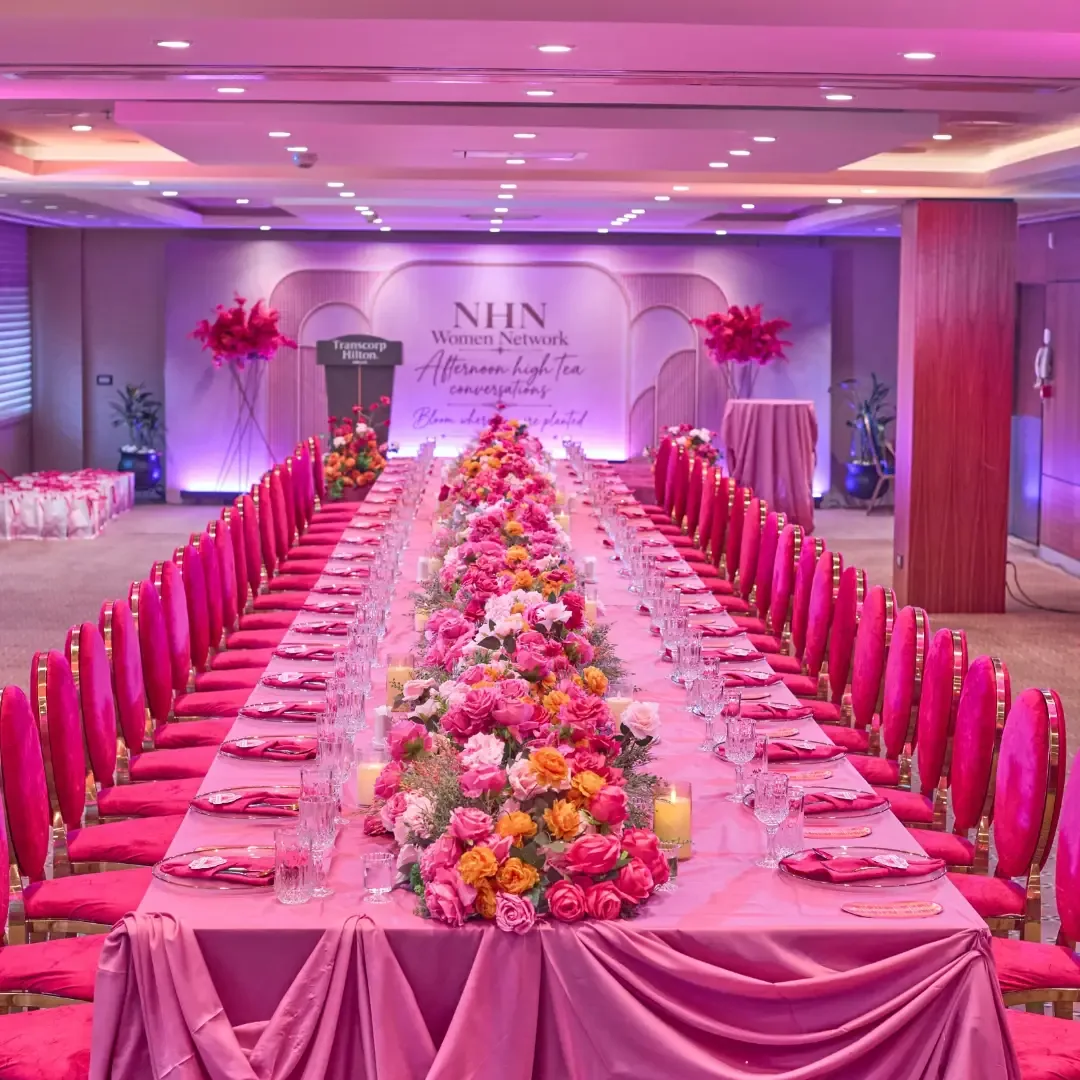 Fuchsia and magenta high-tea banquet with floral runner by Smartest Decor